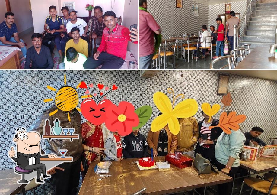 Take a seat at one of the tables at SHRI DURGA RAJASTHANI RESTAURANT