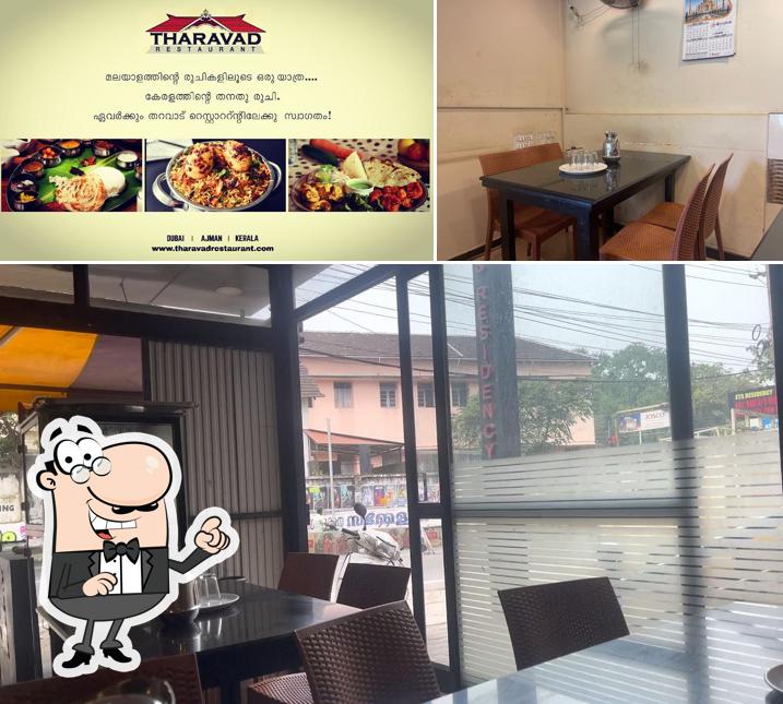 Check out the image showing interior and food at Tharavadu Restaurant