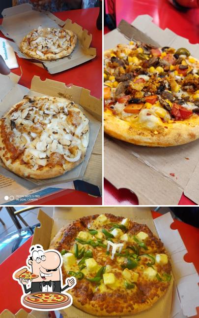 Pick pizza at Domino's Pizza Vikas Cine Mall, Dehradun