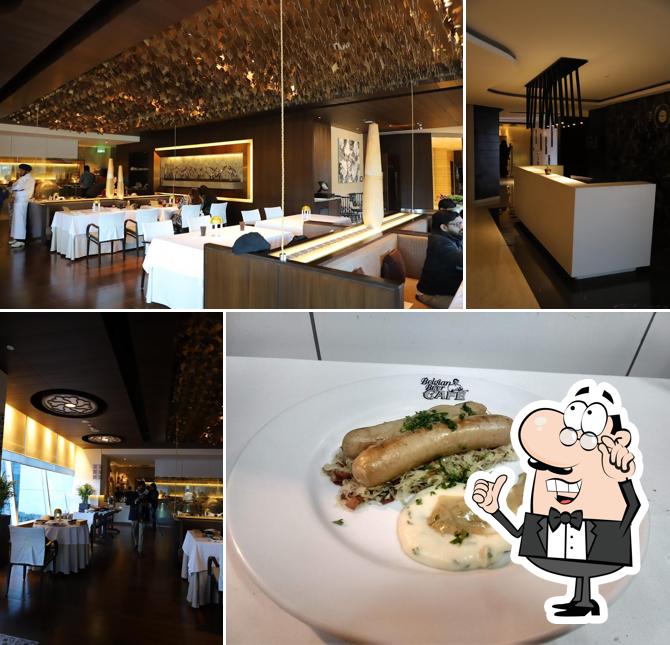 Take a seat at one of the tables at Spice Art - Indian Restaurant