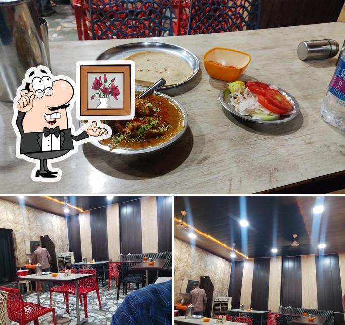 Take a seat at one of the tables at Hotel Meat Ka Badshah