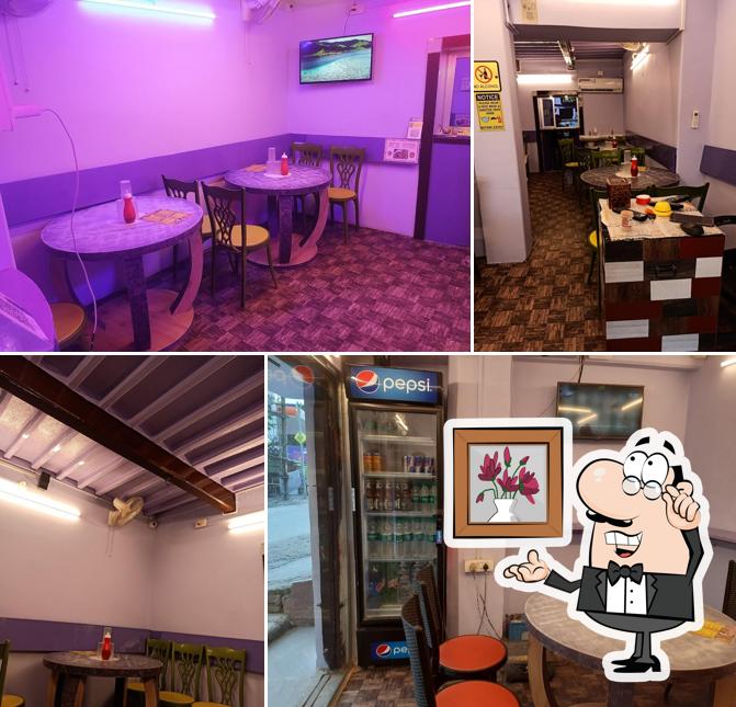 Take a seat at one of the tables at Sandeep Food Zone