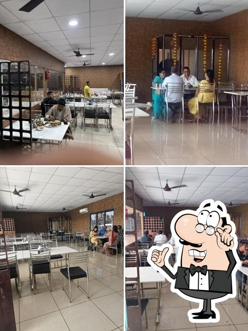 Take a seat at one of the tables at Mithu Marchu - The Restaurant & Cafe