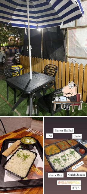Take a seat at one of the tables at Veg Sutra Thane