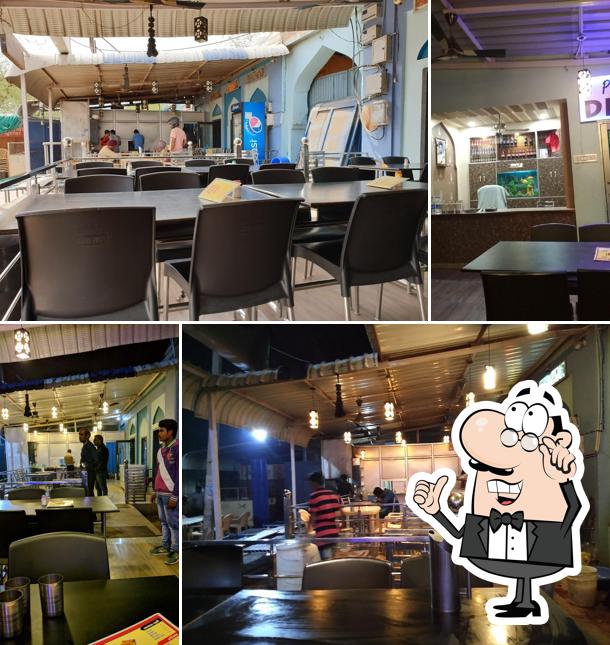 Take a seat at one of the tables at Uppal family food plaza