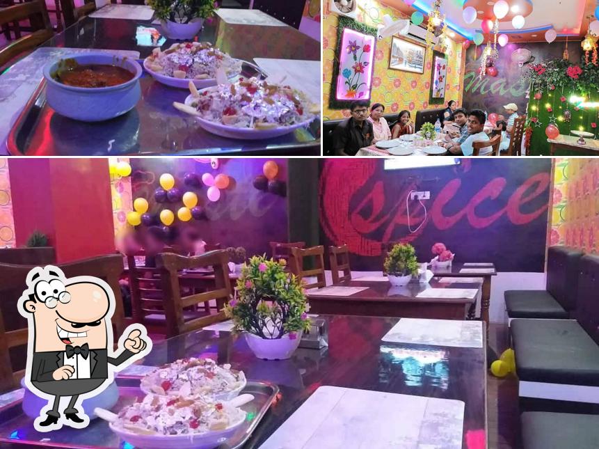 Take a seat at one of the tables at Master Spice Family Restaurant