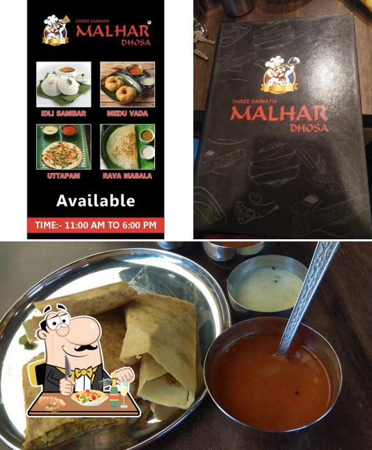 Among different things one can find food and blackboard at Shree Sainath Malhar Dhosa