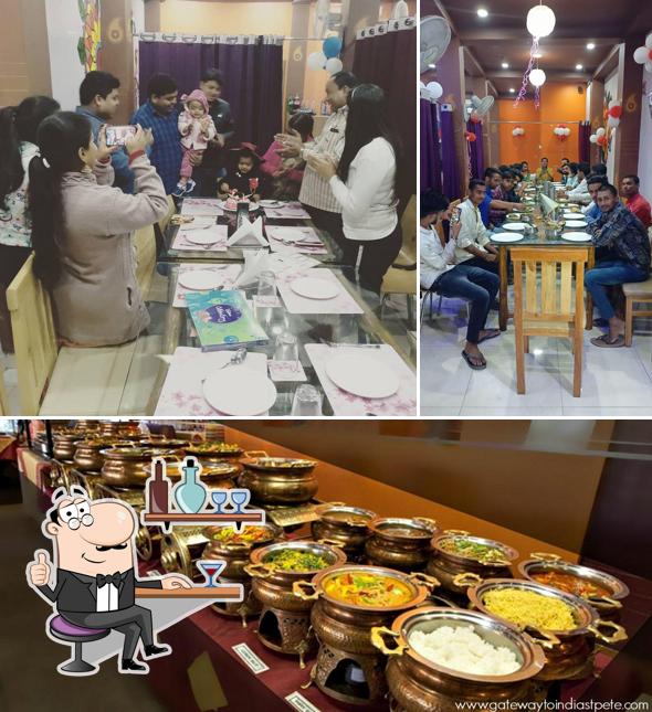 Take a look at the picture showing interior and dining table at Bunk Restro & Cafe
