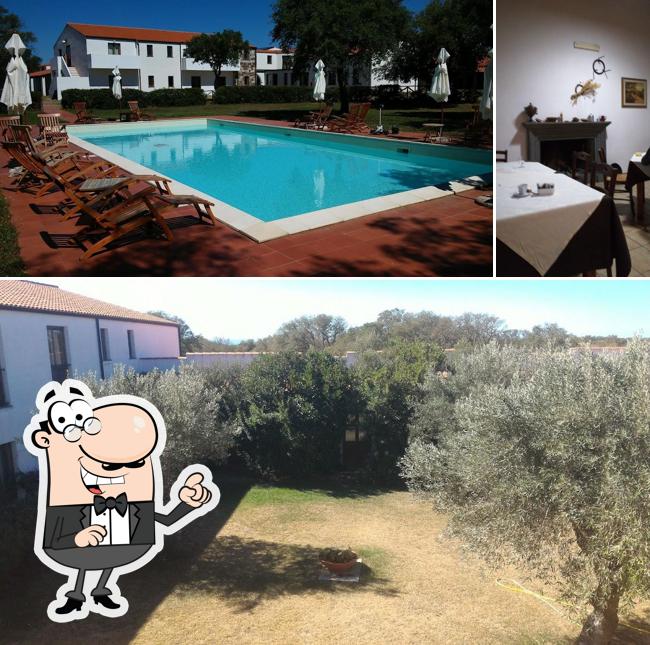La immagine della esterno e tavolo da pranzo di Country Hotel Su Baione