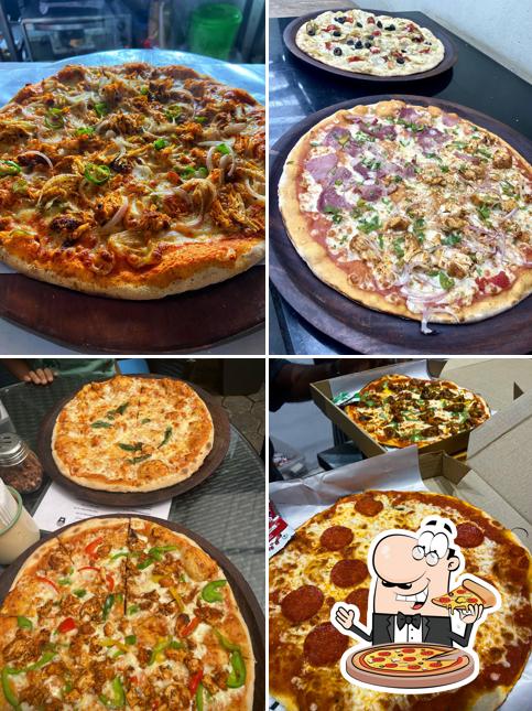 Try out pizza at Open Kitchen Restaurant Pizzeria & Burgers