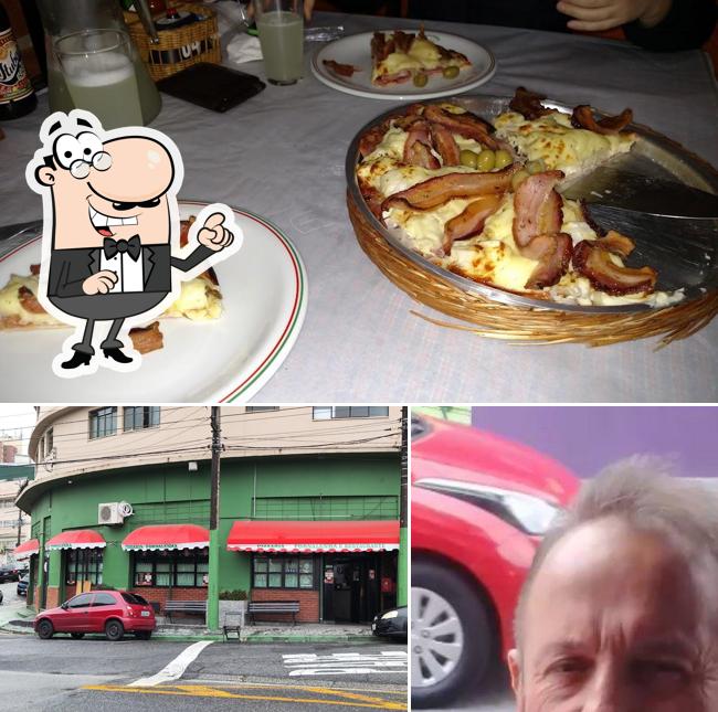 A imagem da exterior e comida a Fornalenha Pizzaria