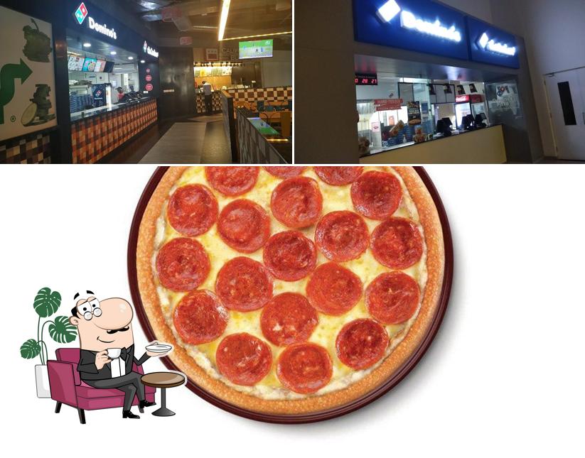 The restaurant's interior and pizza