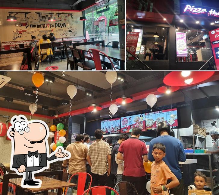 Take a seat at one of the tables at Pizza Hut MVP Colony, Vizag