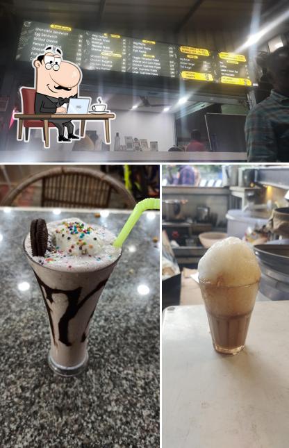 Take a seat at one of the tables at Tanish Bubble Cafe ( Pizza, Sandwich, Burger, Ice cream, Milkshakes, Fresh Juice )