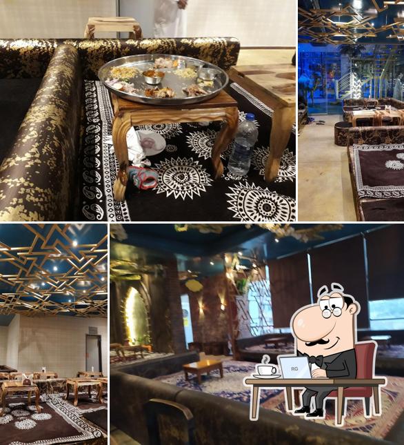 Take a seat at one of the tables at Yum Yum Tree Arabian Food Court gachibowli