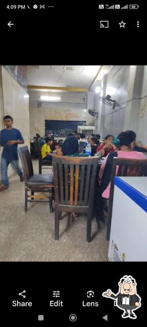 Take a seat at one of the tables at Bawarch Elite restaurant