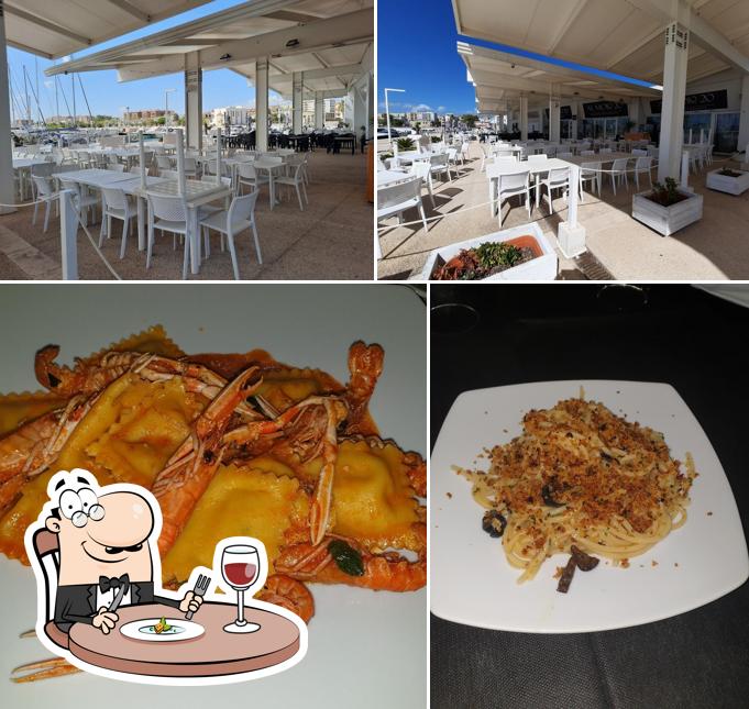 Tra le varie cose da Al Molo 20 si possono trovare la cibo e tavolo da pranzo