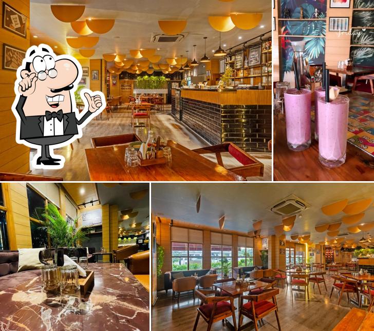 Take a seat at one of the tables at Ouzo Bar & Kitchen Jaipur