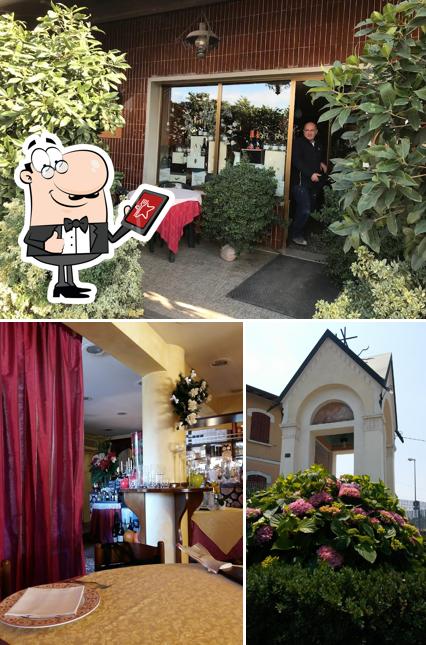 La immagine della esterno e tavolo da pranzo di Al Cacciatore