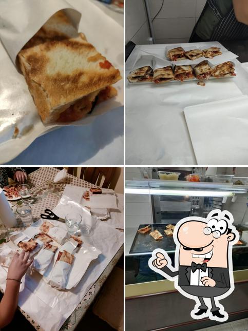 La immagine della interni e cibo di Pizzeria Al Taglio