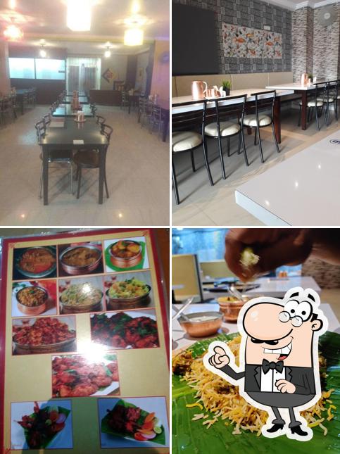 Take a seat at one of the tables at Neha Restaurant