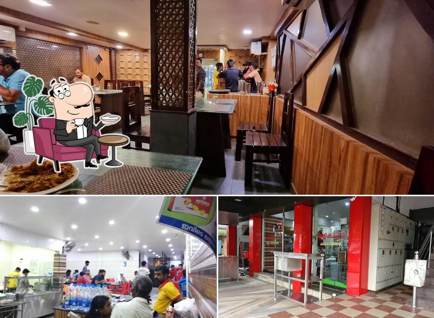 Take a seat at one of the tables at Alakapuri Restaurant