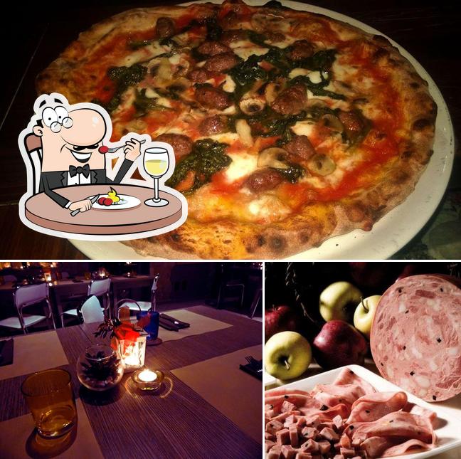Il Connubio Ristopub-Norcineria-Pizzeria a legna si caratterizza per la cibo e interni
