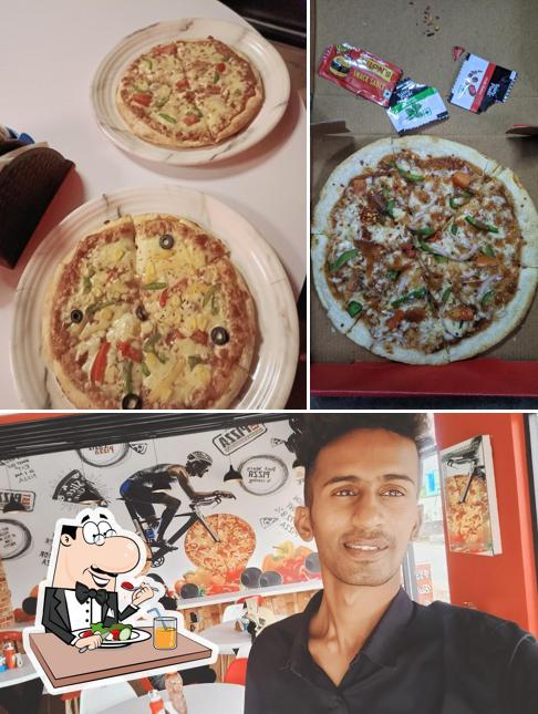 Check out the image displaying food and interior at Laziz Pizza Ramnagar