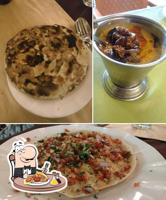 Try out pizza at Hotel Radhika AC Family Garden Restaurant