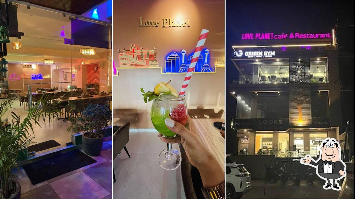 Take a seat at one of the tables at Love Planet Cafe & Restaurant