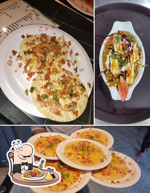 Get pizza at Vrindavan Restaurant