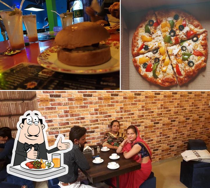 Take a look at the photo showing food and interior at Foodies Cafe