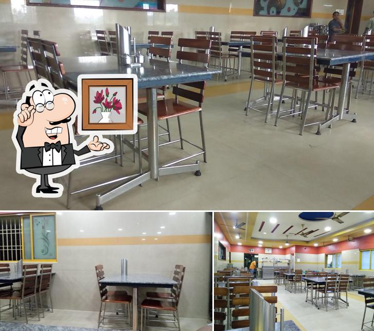 Take a seat at one of the tables at Arya Nivas