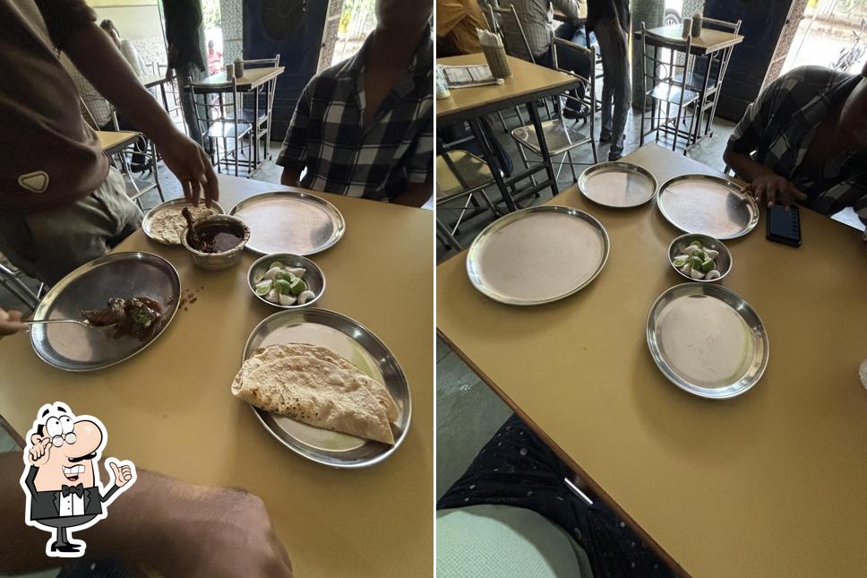 Take a seat at one of the tables at Shriman Saoji Bhojnalaya