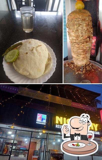 The photo of Nice Day Restaurant’s food and exterior