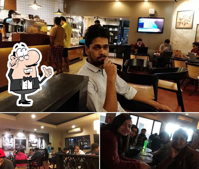 Take a seat at one of the tables at Café Coffee Day