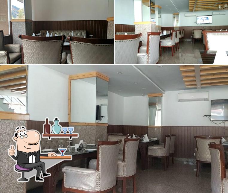 Take a seat at one of the tables at Wine & Dine Restaurant