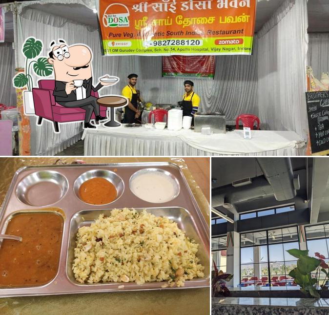 Take a seat at one of the tables at Shree Sai Dosa Bhavan