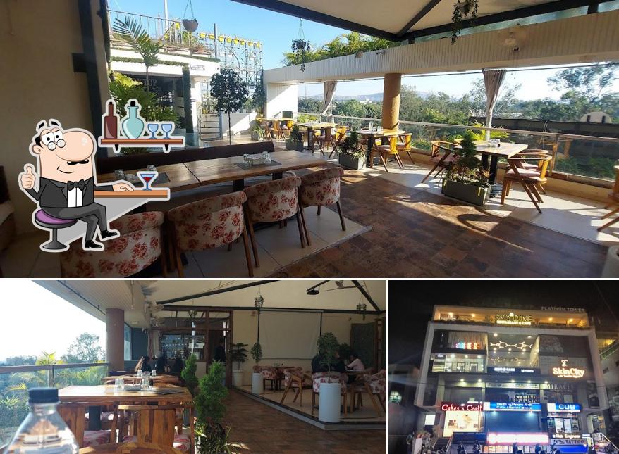 Take a seat at one of the tables at Sky Dine Best Family Restaurant In Dewas Best Rooftop Restaurant in Dewas Best Cafe In Dewas