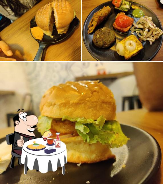 Order a burger at Spicy Bite's Cafe & Restaurants