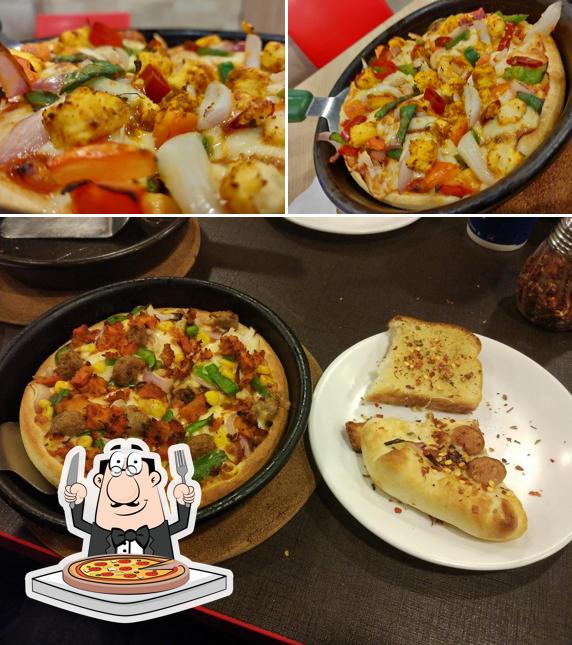 At Pizza Hut JM Towers, Shillong, you can order pizza