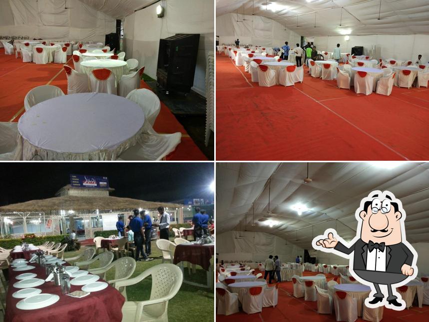 Take a seat at one of the tables at Sigdi Restaurant ( Anand )