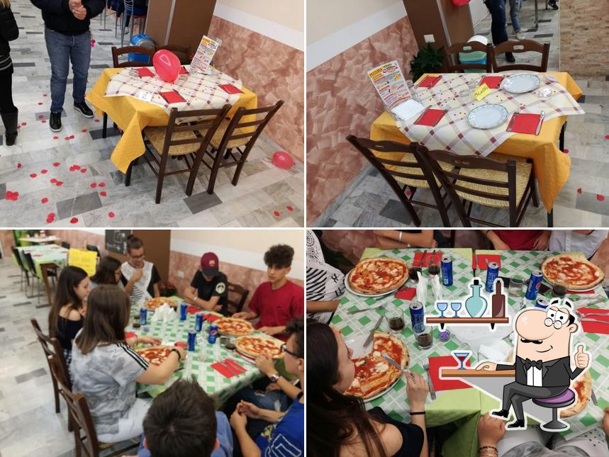 Dai un'occhiata agli interni di PIZZERIA La Bufalina