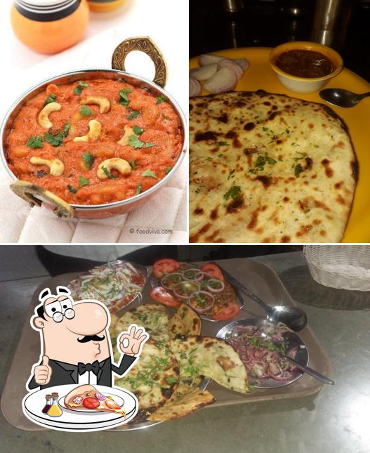 Get pizza at Singh Brothers Pure Veg Hotel and family restaurant