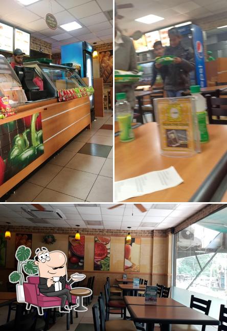 Take a seat at one of the tables at Subway