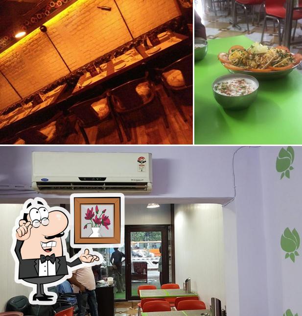 Take a seat at one of the tables at (TCK) The Champaran's Kitchen
