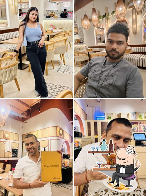 Take a seat at one of the tables at Cafe Delhi Heights