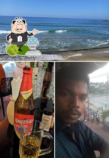 Among different things one can find exterior and beverage at Naya Athithi Beach Restaurant, Kovalam