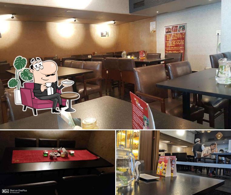 Take a seat at one of the tables at South Ruchis Square,Organic Fine Dine Restaurant