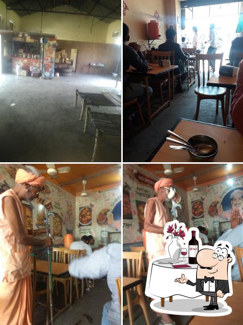 Among various things one can find dining table and interior at Sheru Dhaba